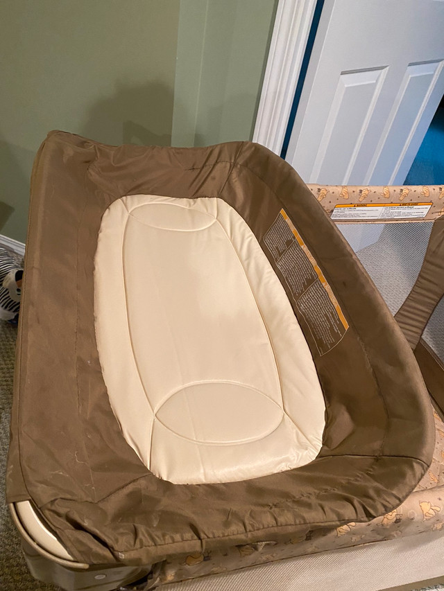 Graco Pack N’ Play with change table. Winnie the Pooh Playpens