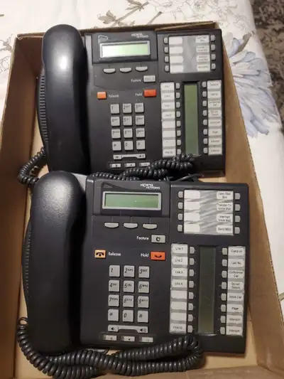Two Nortel T7316e business phones, known for their reliability and functionality, are available for...