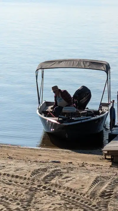 Good condition. For the avid fisherman. Bimini top, cover, and trailer has a foldaway know hitch