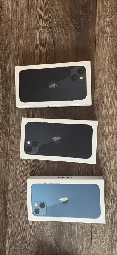 Three iPhone 13 boxes and 1 iPhone 8 box Empty. No phone included.