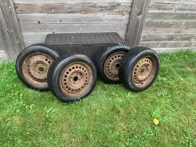 WINTER TIRES ON RIMS $ 150.00 FOR THE SET. FROM NISSAN SENTRA