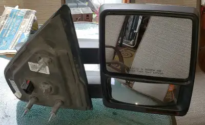 These are a pair of used Ford F250 mirrors, both the left and right side, perfect for replacing dama...