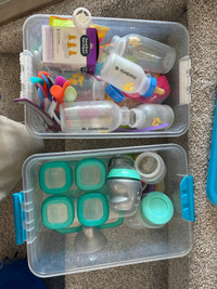 Miscellaneous baby bottles and food containers. Used but clean.
