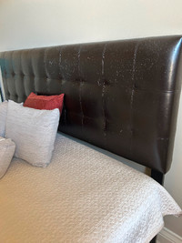 King size mattress with faux leather headboard.