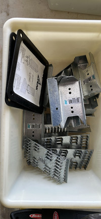Box of galvanized deck building fasteners and hardware