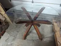 Round glass table and three chairs