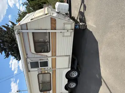 An oldie but a goodie. Solid, dual axle trailer sleeps 3-4. 45 w solar. Manual awning. Newer h/w hea...