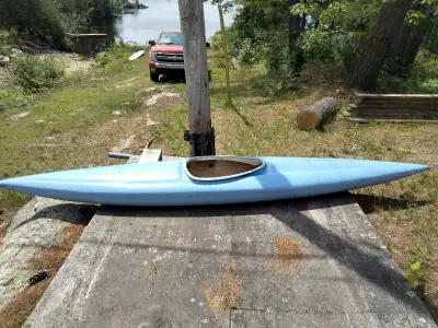Blue kayak, 13 feet long, about 2 feet wide