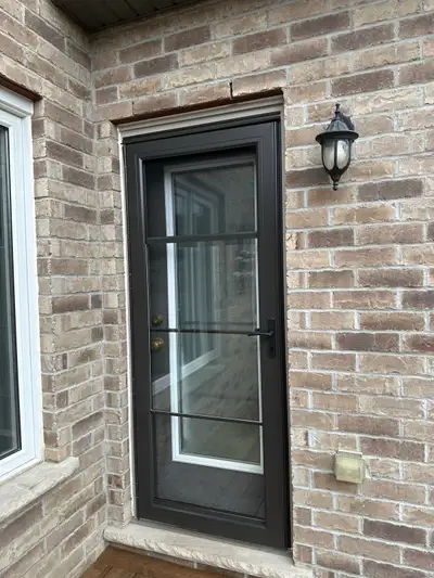 Brand new storm door with sliding glass screen and bronze handle. measurement are 32“ x 80“ we have...