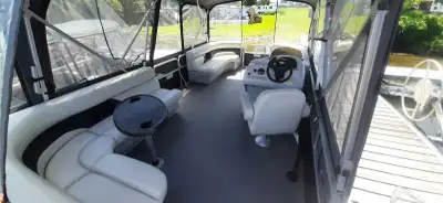 20 foot 2015 legend pontoon with shorelander trailer. Low hours, well taken care of. Full wrap and B...
