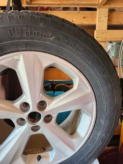 Get ready for winter with this set of four pre-owned Goodyear UltraGrip Ice tires, size 245/60R18, m...