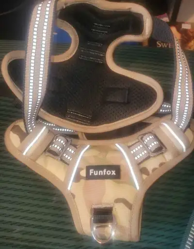 This Funfox dog harness is designed for comfort and control during walks, featuring a camouflage pat...