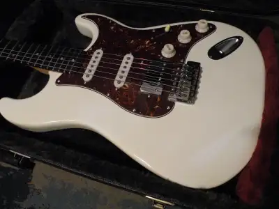Olympic white, full size body with rosewood fretboard. Brand New Tortoise Shell Pickguard loaded wit...