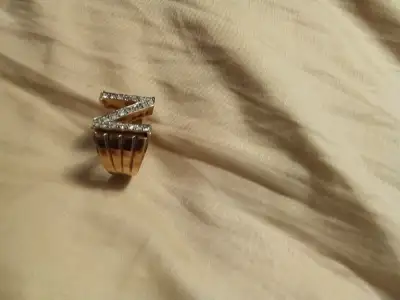 Mint condition Custom 10k gold ring iced out with like 20 small diamonds on the front , pretty big t...