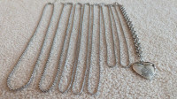 8 silver in color chains  (costume jewelry)