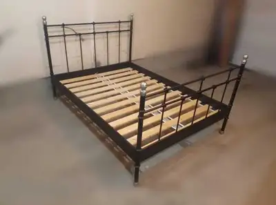 Ikea all metal bed frame with wooden slats in good used condition. Minor wear. Still solid. Double s...