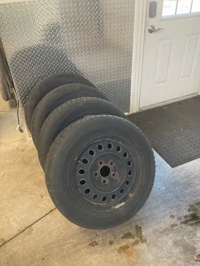 4 snow tires on rims 225/65R17 $ 200.