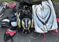Lot of hockey goalie equipment pads chest protector etc