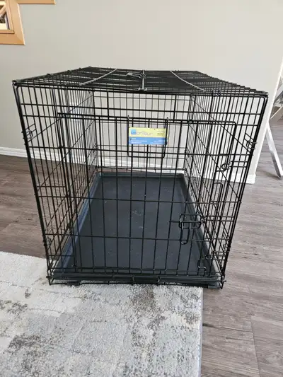 Great condition, metal dog crate with one door. Measures 36" deep x 23" wide x 25" high. Cash only....