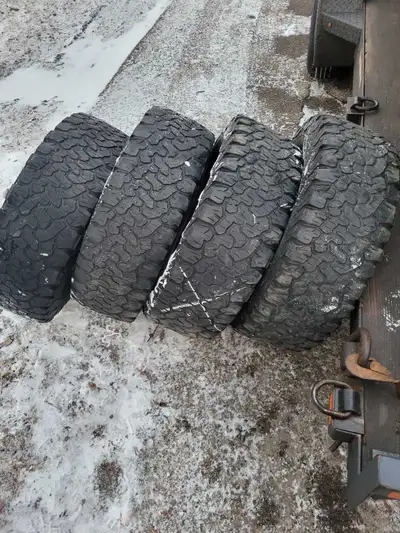 I am selling a set of used Bf Goodrich All-Terrain K02 tires, known for their exceptional durability...
