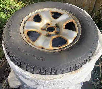 Set of winter tires on rims, originally from a 2012 Honda CR-V. Tires are quite old and may not have...
