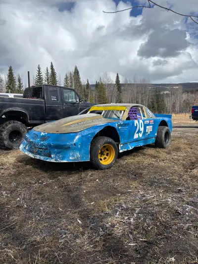 Late model dirt track car, comes with spare axels, rear end parts, control arms, springs, rims, and...