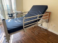 Invacare etude hospital bed with full rails and medical mattress