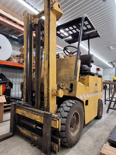 5000 lb Clark/Eaton electric forklift. Needs new battery. All functions work. Comes with charger and...