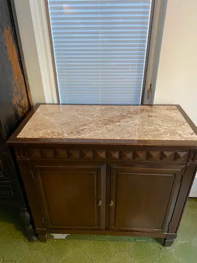 a vintage dark wood cabinet featuring an inlaid marble top, View more