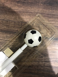 Soccer ball curtain rod
