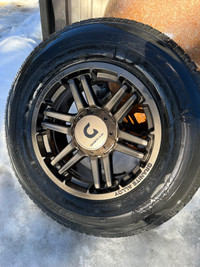 Firestone studded winter tires 255/70R17 with bronze rims 