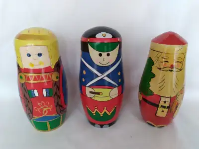A set of 3 Matryoshka Dolls. 2 of them have a minor crack on the outside, but the rest are in perfec...