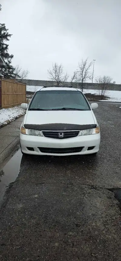 This 2002 Honda Odyssey features a reliable engine and spacious interior, perfect for comfortable fa...