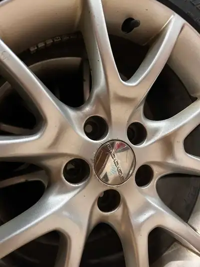I am selling a set of used low-profile tires and rims that fit a 2013 Dodge Dart, perfect for enhanc...