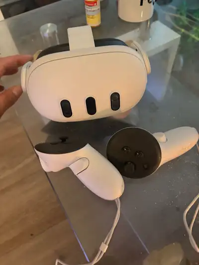 Meta Quest 3 VR headset, including two touch controllers. This item is in good condition, light prev...