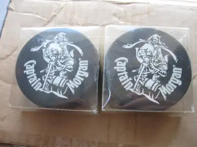 2 cool promotional hockey pucks for Capt. Morgan, View more