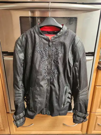 Speed and Strength black textile motorcycle jacket, size large, featuring a red quilted liner, intri...