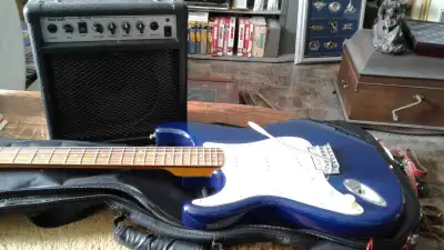 Mint condition, Jay Turser Left Hand Electric Guitar with AMP and new set of strings on the guitar a...