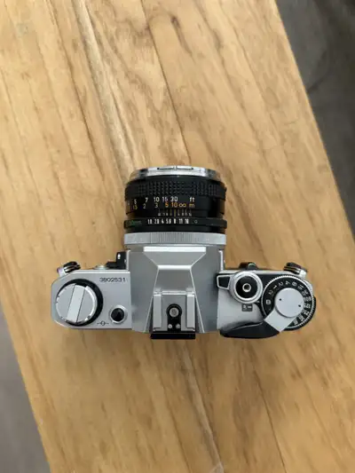 I'm clearing out some cameras in my film camera collection Canon AE-1 + 50mm F/1.8 chrome nose (aper...