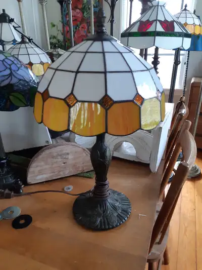 Excellent condition. 19"H. Heavy ornate base. Price is firm.