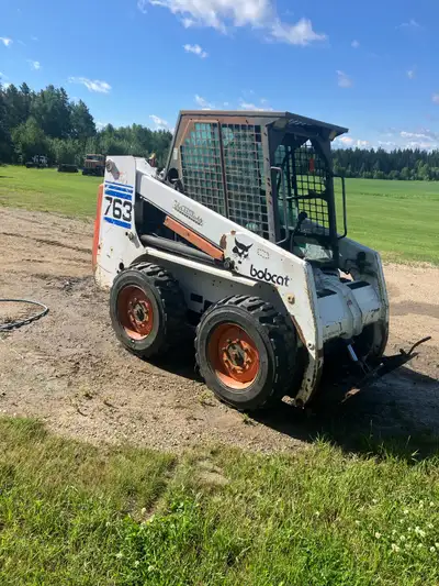 1998 Bobcat 763, 5300 hours c/w 5 ft smooth bucket, 7ft hydraulic angle blade, have a door for it. R...