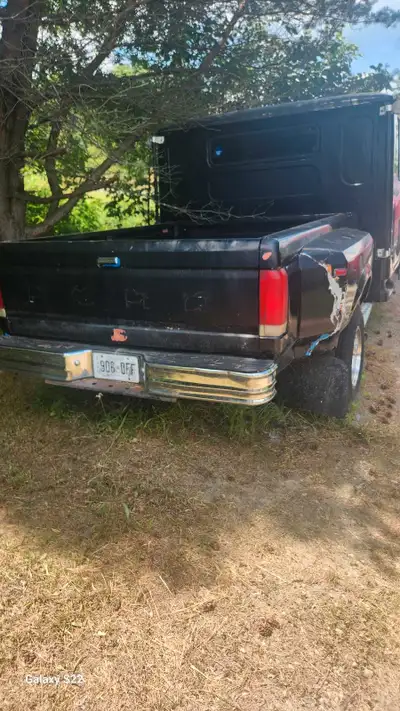 This is a used 1982 Ford Truck with a unique custom cab and a sturdy flatbed, perfect for hauling an...