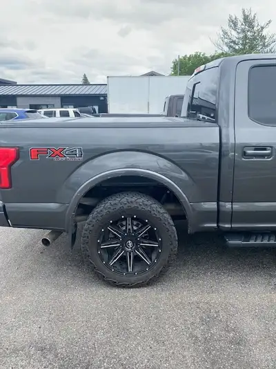 This OEM Ford Hard Tri-Fold Flush Mount Tonneau Cover for F150 Short Box (5.5') fitment 2015-2020 wa...