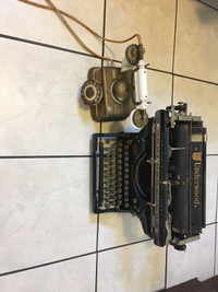Antique underwood typewriter & antique telephone 