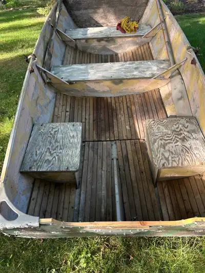 Duck hunting boat used for hunting for many years. Trailer included extra tires and oars included