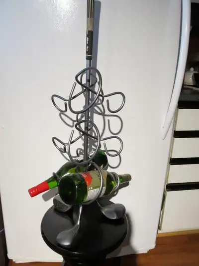 Golf themed metal bottle holder., View more