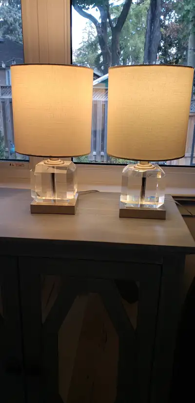A pair of stunning, contemporary, crystal based lamps with white shades. Neutral look and clean line...