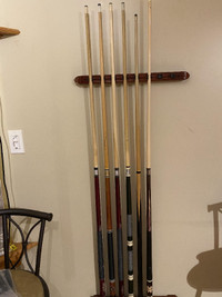 Various pool cues with good tips