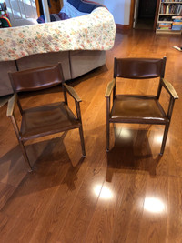 Two wood armchairs in excellent condition.