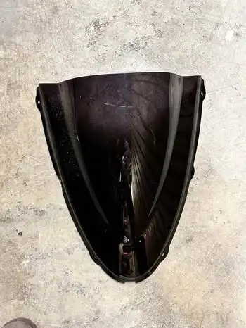 Selling a tinted windshield off a 2005 Kawasaki Ninja ZX6R. • Dark smoked/tinted finish • Has a mino...